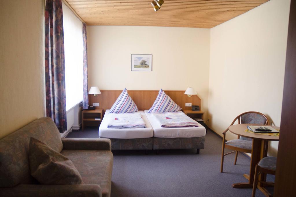 Hotel Zum Wikinger Neßmersiel Pokoj fotografie